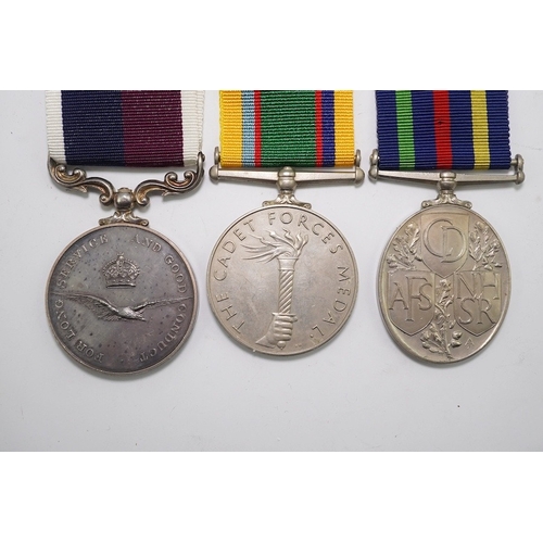 343 - Three assorted service medals; GVI Cadet Forces medal to ACT. FG. Off. A. Liddell R.A.F.V.R (T); ERI... 