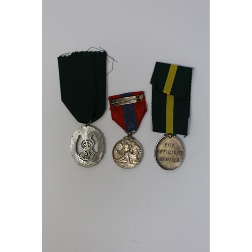 350 - Three assorted service medals; Ed VII Volunteer Officer's Decoration hallmarked for 1905; GV Imperia... 