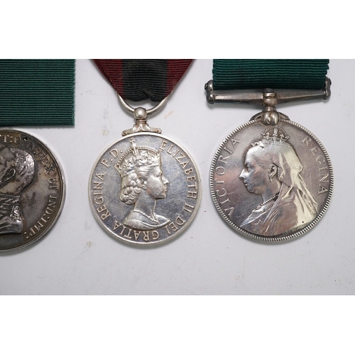 351 - Four assorted Service medals; Vict unnamed Volunteer Long Service medal; GV Colonial Auxiliary Force... 