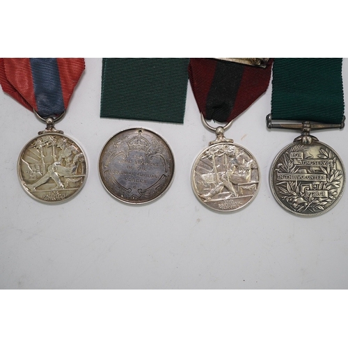 351 - Four assorted Service medals; Vict unnamed Volunteer Long Service medal; GV Colonial Auxiliary Force... 