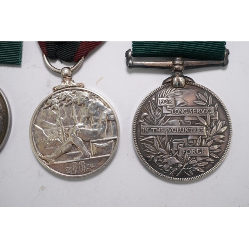 351 - Four assorted Service medals; Vict unnamed Volunteer Long Service medal; GV Colonial Auxiliary Force... 