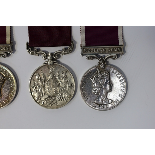 352 - Four Army Long Service and Good Conduct medals; Vict to 21579 Gunr A.Milln. R.A.; GV to 1404425 B.Q.... 