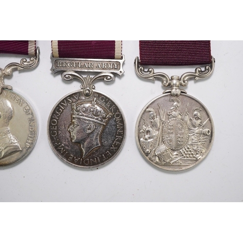 352 - Four Army Long Service and Good Conduct medals; Vict to 21579 Gunr A.Milln. R.A.; GV to 1404425 B.Q.... 