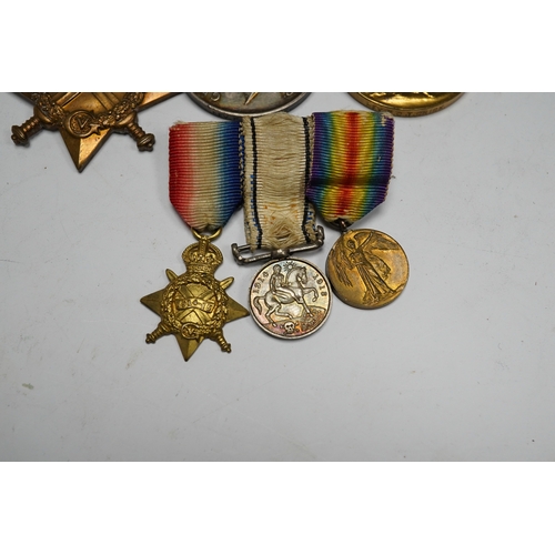 353 - A First World War medal trio awarded to the Rev. P.C.T. Crick A.C.D., together with the miniature se... 