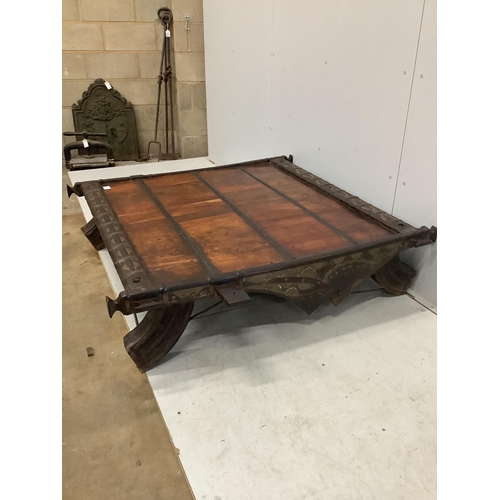 39 - An Indian hardwood and iron mounted low square table, width 138cm, depth 130cm, height 33cm. Conditi... 