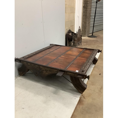 39 - An Indian hardwood and iron mounted low square table, width 138cm, depth 130cm, height 33cm. Conditi... 