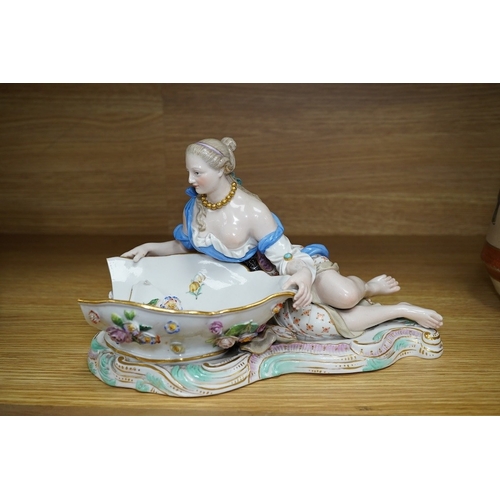 404 - A Meissen female figural dish,  27cm wide. Condition - dish damaged (pieces in bag), crack near fron... 