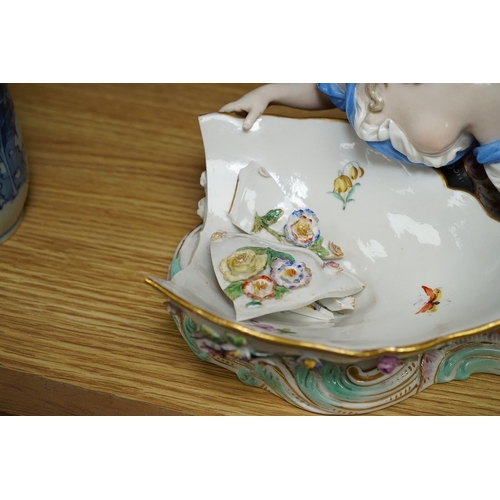 404 - A Meissen female figural dish,  27cm wide. Condition - dish damaged (pieces in bag), crack near fron... 