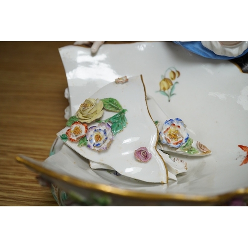 404 - A Meissen female figural dish,  27cm wide. Condition - dish damaged (pieces in bag), crack near fron... 