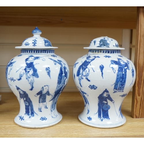 405 - A pair Chinese blue and white street performers baluster vases, circa 1900, 25cm. 25.5cm. Conditio... 