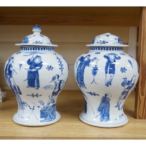 405 - A pair Chinese blue and white street performers baluster vases, circa 1900, 25cm. 25.5cm. Conditio... 