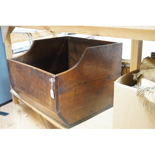 413 - An early 20th century oak dog basket, 65cm wide. Condition - fair