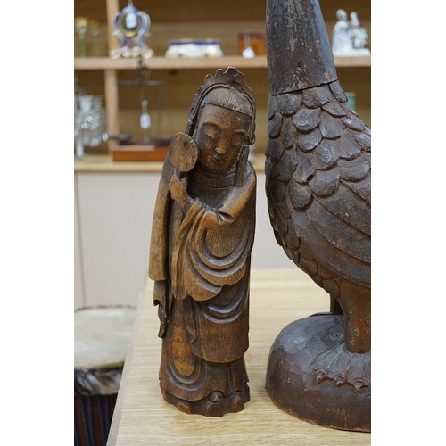 414 - A Chinese bamboo figure of a lady and a large carved wooden bird, 55cm high. Condition - fair