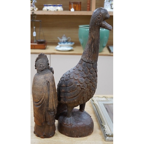 414 - A Chinese bamboo figure of a lady and a large carved wooden bird, 55cm high. Condition - fair