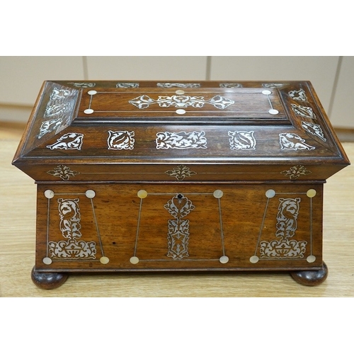 415 - A Victorian rosewood and mother-of-pearl inlaid sarcophagus tea caddy, 39cm wide. Condition - fair... 