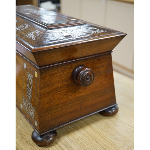 415 - A Victorian rosewood and mother-of-pearl inlaid sarcophagus tea caddy, 39cm wide. Condition - fair... 