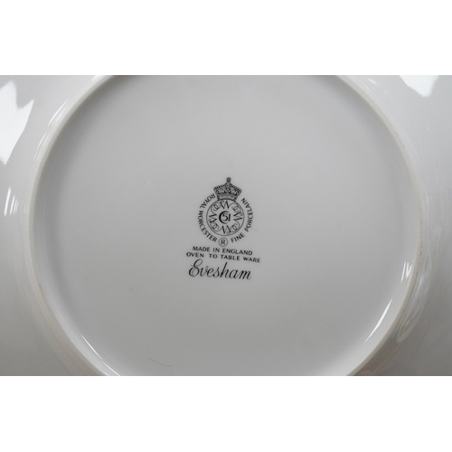 424 - A Royal Worcester Evesham pattern dinnerware to include dinner plates, soup bowls and ramekins, larg... 