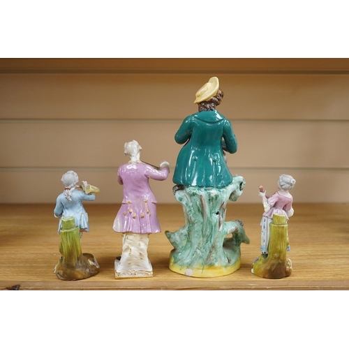 438 - A mid 19th century Staffordshire figure wearing a green jacket, a Berlin KPM figure of a violinist a... 