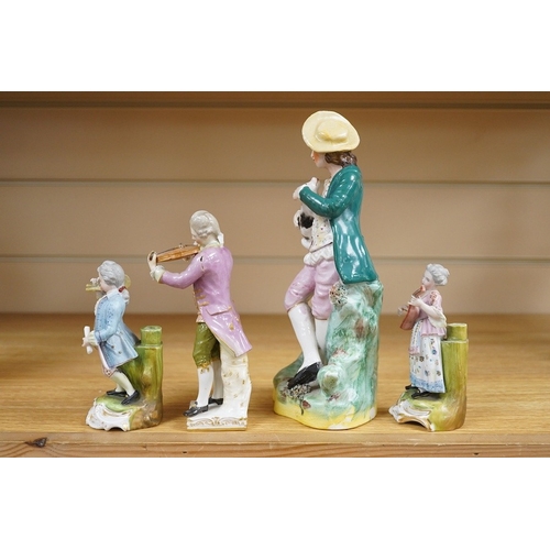 438 - A mid 19th century Staffordshire figure wearing a green jacket, a Berlin KPM figure of a violinist a... 