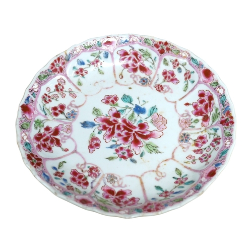 448 - A Chinese famille rose moulded saucer dish, Yongzheng/Qianlong, 16cm in diameter. Condition - fair... 