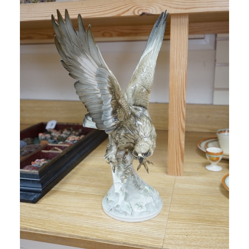 453 - Karl Tutter (1883-1969) for Kutschenreuther, a porcelain model of a hawk, 42cm. Condition - restorat... 