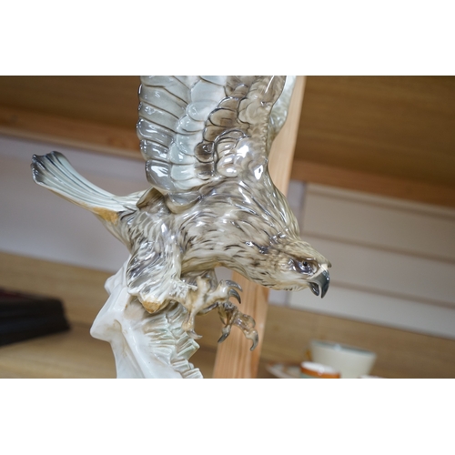 453 - Karl Tutter (1883-1969) for Kutschenreuther, a porcelain model of a hawk, 42cm. Condition - restorat... 