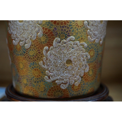 477 - A Japanese Satsuma pottery lidded jar, Meiji period, decorated and gilded with flowers, signed to th... 