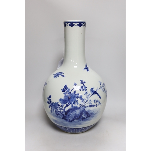 483 - A large Chinese blue and white bottle vase, 46cms high. Condition - good