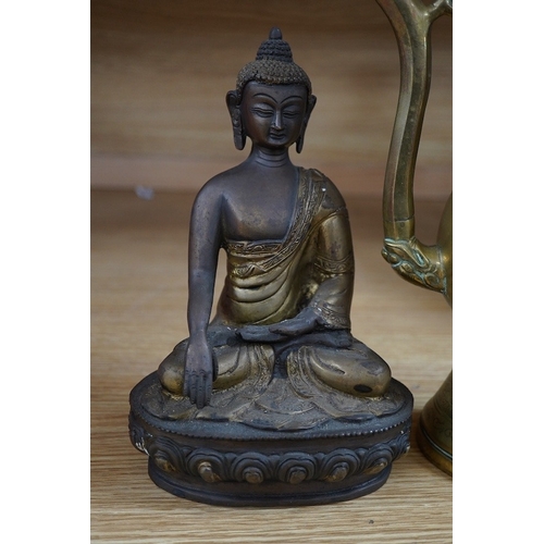 490 - A South East Asian bronze Buddha and an engraved brass wine ewer, 39cm high. Condition - good