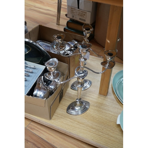 499 - A quantity of assorted plated ware including a pair of three light candelabra - 39cm high. Condition... 