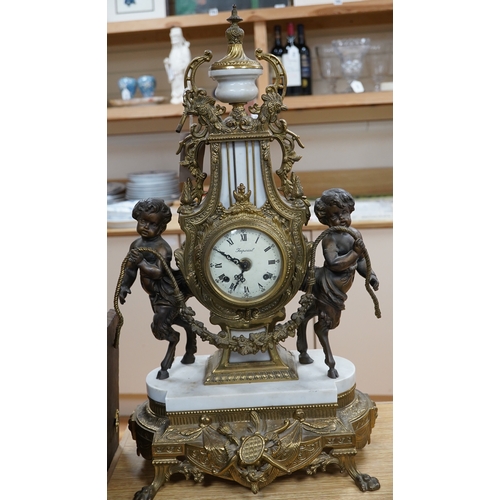 502 - A Louis XV style brass and marble mantel clock, with key, 60cm tall. Condition - good