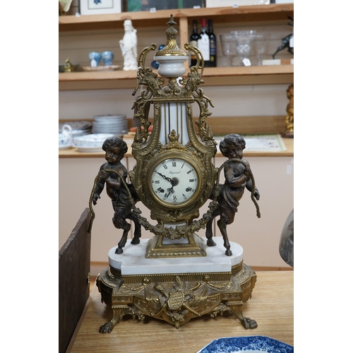 502 - A Louis XV style brass and marble mantel clock, with key, 60cm tall. Condition - good