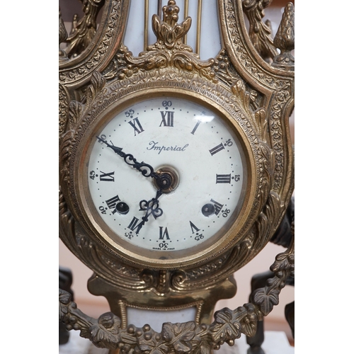 502 - A Louis XV style brass and marble mantel clock, with key, 60cm tall. Condition - good