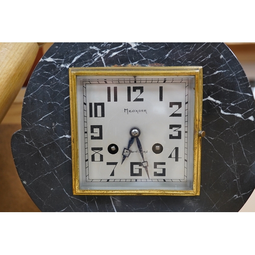 509 - A French Art Deco black and white marble clock, with an ornately painted Spelter figure of a seated ... 