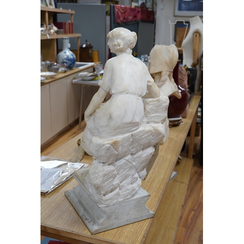 519 - A French 1920s-30s alabaster sculpture of a lady seated on a stone wall, sculpture mounted on a ma... 