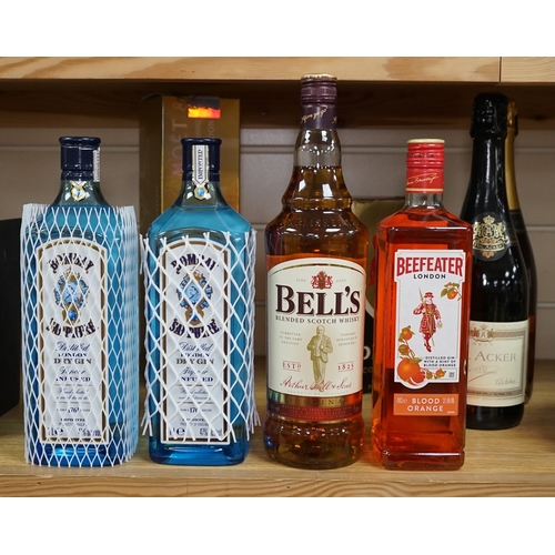 527 - Nine various bottles of wine and spirits to include Albert Et Fils champagne, Bells Scotch whisky an... 