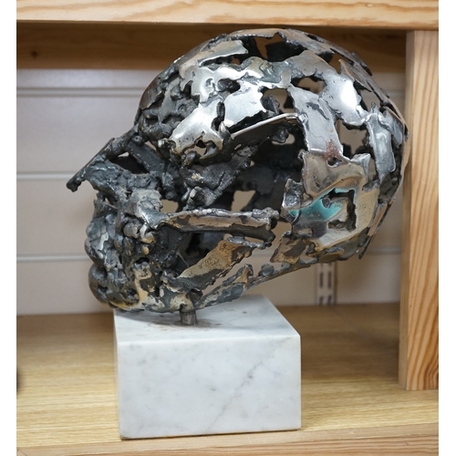 529 - A modern polished steel skull, pierced and mounted on square white marble plinth, circa 1975, 31cm h... 