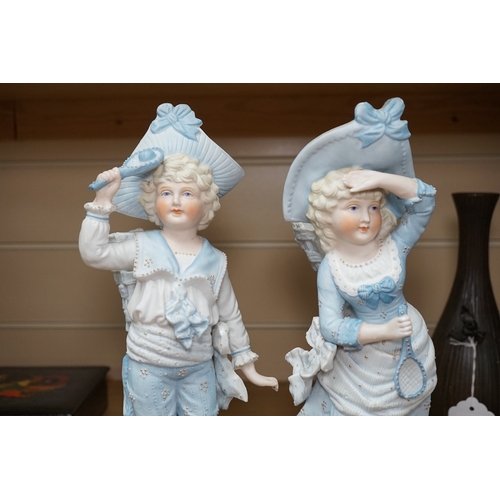 532 - A pair of 19th century German figurative bisque spill vases, 30cm high. Condition - good