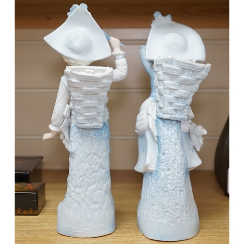 532 - A pair of 19th century German figurative bisque spill vases, 30cm high. Condition - good