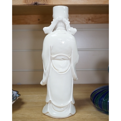 543 - A Chinese blanc de chine Buddha figure, stamped to the reverse, 30cm high. Condition - Good