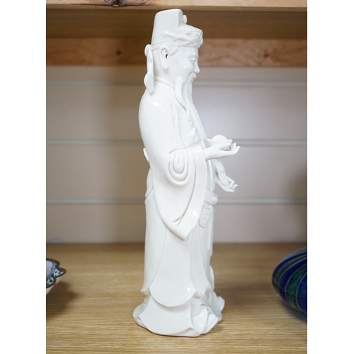 543 - A Chinese blanc de chine Buddha figure, stamped to the reverse, 30cm high. Condition - Good