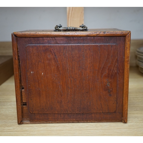 553 - A Chinese boxed bone Mah jong set with five drawers, 19cm high. Condition - poor to fair, case damag... 