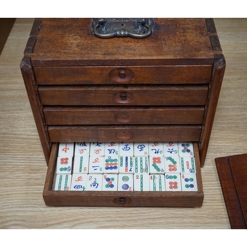 553 - A Chinese boxed bone Mah jong set with five drawers, 19cm high. Condition - poor to fair, case damag... 