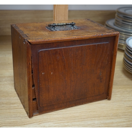 553 - A Chinese boxed bone Mah jong set with five drawers, 19cm high. Condition - poor to fair, case damag... 