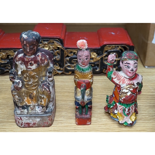 555 - A carved painted South East Asian figure on stand, lacquered wood figures and carvings and a carved ... 