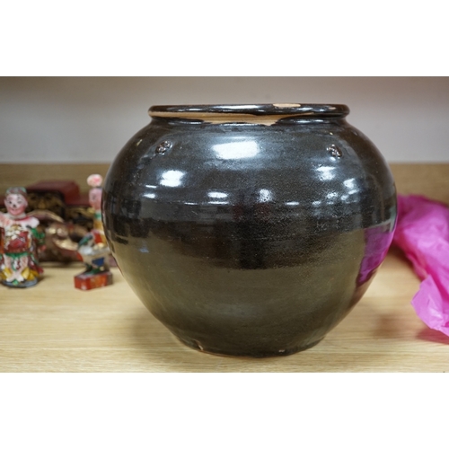 557 - A Chinese Henan black glazed jar, Song dynasty, 23cm high. Condition - some glazing missing in manuf... 