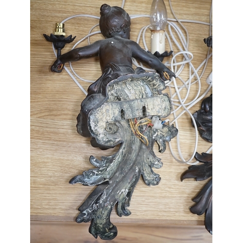 564 - A pair of cast metal caryatid putti two light wall sconces, 45cm high. Condition - poor