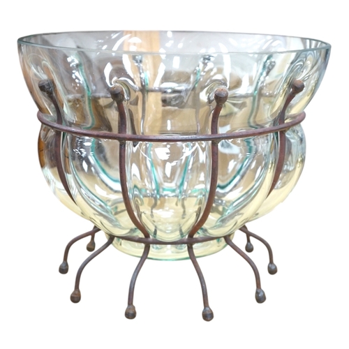 566 - A glass vase and a similar bowl with wrought iron stand, vase 38cm high. Condition - good