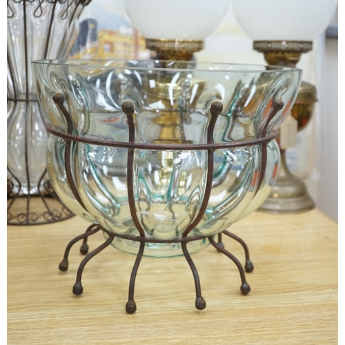 566 - A glass vase and a similar bowl with wrought iron stand, vase 38cm high. Condition - good