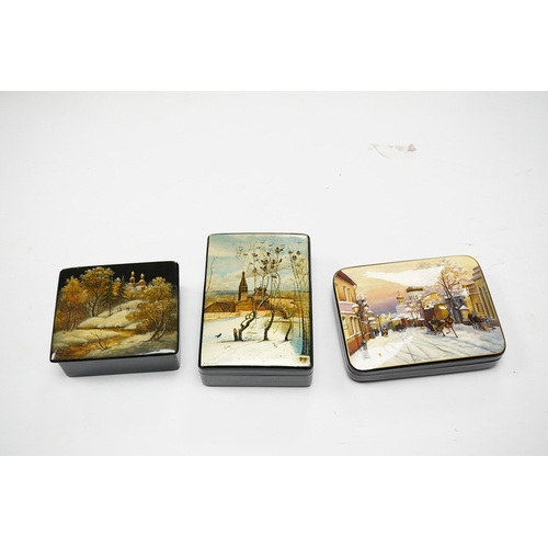 571 - Three late 19th/early 20th century Russian lacquer boxes, decorated with snow scenes, largest 13.5cm... 